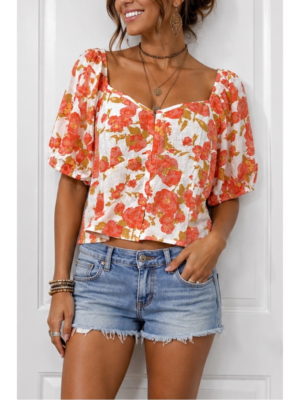 Sienna Sky blouse with vibrant coral floral patterns w/ voluminous puff sleeves